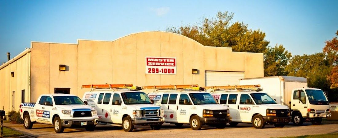 The Master Service fleet of branded service trucks outside the Tulsa shop